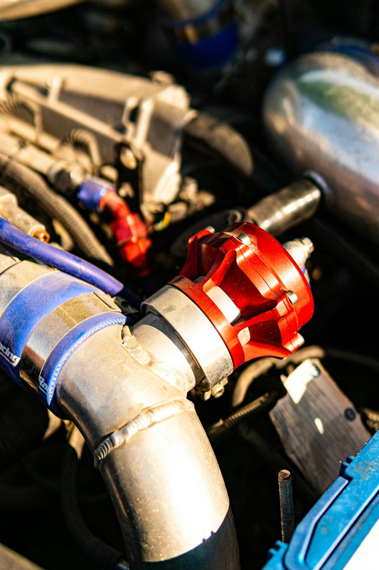 Close-up of a red blow-off valve on a car engine